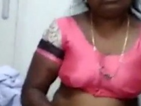 Enjoy a Tamil aunty's boob press in this hot video