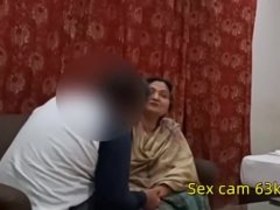 Chubby Indian auntie enjoys steamy sex with her lover in her living room