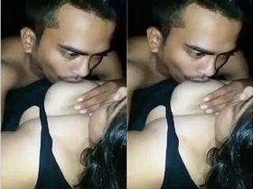 Lover fondles and sucks on girlfriend's breasts
