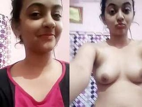 Indian beauty fondles her breasts in solo performance