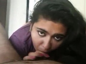 A young Indian woman pleases her boyfriend with oral sex