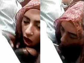 Arab woman in hijab performs oral sex in a vehicle