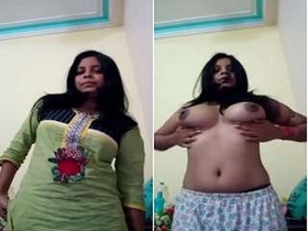 A beautiful girl indulges in self-pleasure with her breasts on camera