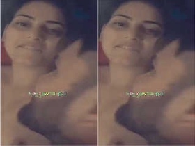 Pretty girl with big breasts giving oral pleasure