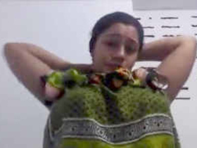 Busty aunt teases with her big breasts in online video