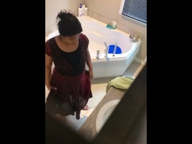 A mature Indian woman and her companion have a relaxing shower together