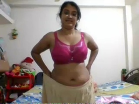 Indian girlfriend strips down to reveal her body in pink lingerie