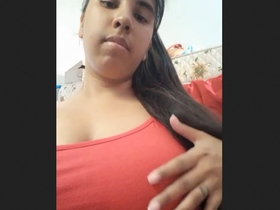 Indian woman with large breasts seductively shows off