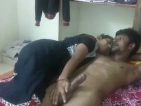 Indian wife gives handjob to her husband before sex
