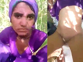 A married woman from a village gets intimate with her boyfriend in an open field
