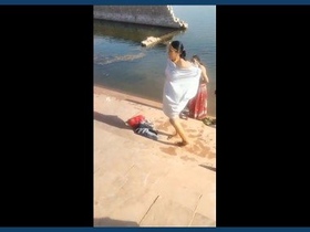 Indian village women bathe outdoors
