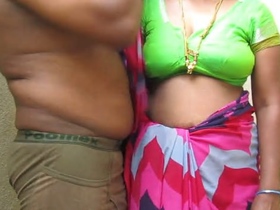 Tamil aunty's large breasts are fondled by her spouse in an erotic film