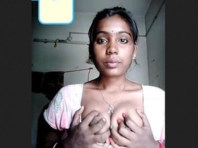 A sultry video featuring an Indian beauty revealing her ample bosom