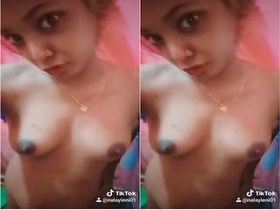 Tamil babe flaunts her big boobs in a steamy video