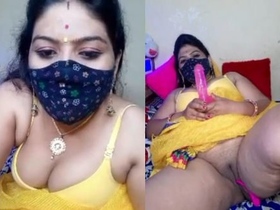 Geeta, the seductive aunt, moistly stimulates her intimate area with her fingers