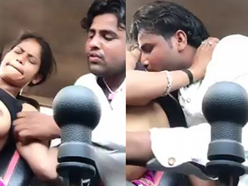 Arousing Indian couple passionately fondles each other's breasts in a vehicle