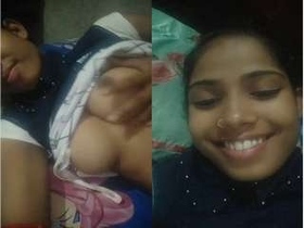 A stunning Indian girl gives a sensual blowjob and flaunts her breasts