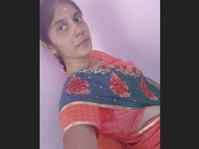 An Indian college girl proudly displays her large breasts in an adorable video