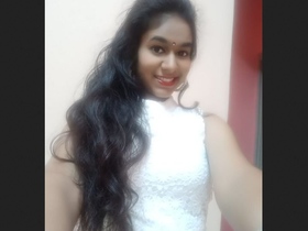 An Indian girlfriend displays her attractive physique for her partner while getting dressed