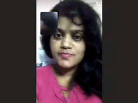 Aroused female pleasuring herself on a video chat