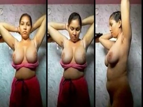 Amateur Desi girl flaunts her huge natural breasts in the bathroom