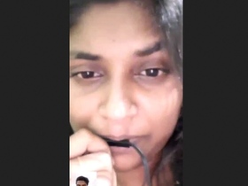 A South Asian woman masturbates for her partner's enjoyment