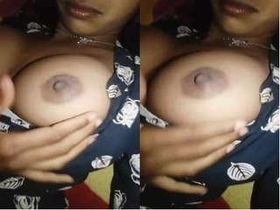 Tamil beauty flaunts her breasts in a seductive manner