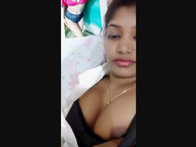 A seductive Indian woman reveals her breasts during a video chat