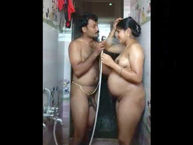 A pregnant woman takes a bath with her spouse