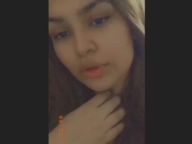 A Pakistani woman proudly displays her large breasts