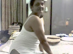 Indian mature woman engages in sexual activity with her husband's friend in a recorded video