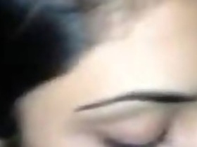 A young woman performing oral sex on a man