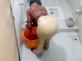 Beautiful Pakistani woman relaxes in the tub