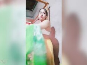 A seductive Desi girl reveals her juicy XXX melons and pleasures herself with her fingers