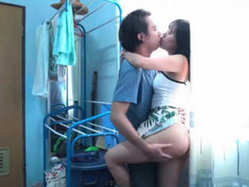 A stunning pair engages in intimate relations within the confines of a hotel suite.