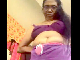Desi auntie shows off her curves while changing into sexy lingerie