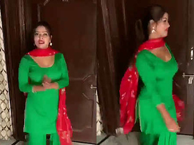 Curvy woman performs sensual dance in traditional Indian attire