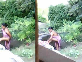 Indian girl takes outdoor bath
