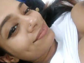 Cute girl from Sri Lanka records a video of herself taking selfies