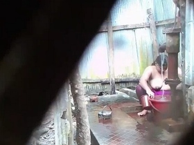 Indian wife's outdoor shower scenes captured on film