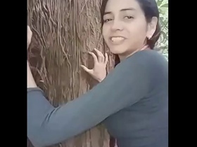 A charming Indian girl engages in risque behavior outdoors