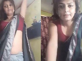 Navel cleavage and boobs are highlighted in saree