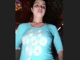 Attractive and adorable spouse from village displays and stimulates herself