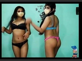 Indian women engage in lesbian activities during a hotel-based performance