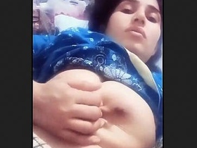 Aroused Indian wife squeezes her breasts in seductive display