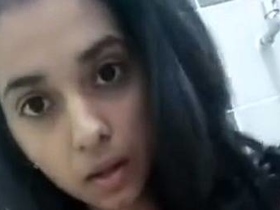 College girl with big tits flaunts her hairy pussy in solo video