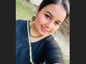 Busty girl flaunts her curves in a seductive display