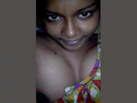 A charming Indian woman reveals her breasts