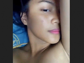 Horny girl masturbates her pink pussy with her fingers