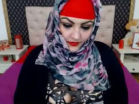 Desi aunt in hijab uses a large toy for self-pleasure and makes loud sounds